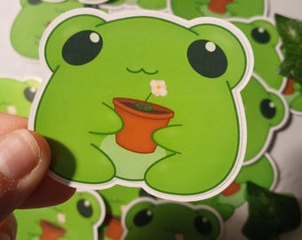 Pegatina brillante de rana en maceta