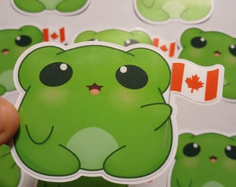 Pegatina brillante de rana con la bandera de Canadá