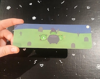 Marcapáginas de rana del trío del cementerio brujo