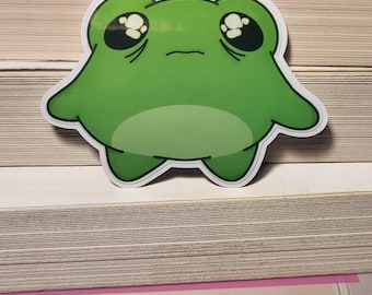 Pegatina brillante de la rana desesperada