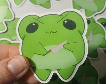 Pegatina brillante de rana apuñalada con cuchillo