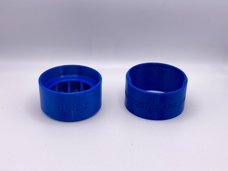May include: Two blue 3D printed plastic rings. One ring is labeled "8/4 OZ" and the other ring is labeled "RigoMakes.com".