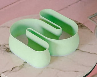 Maceta para suculentas con diseño de garabatos en forma de S en verde menta