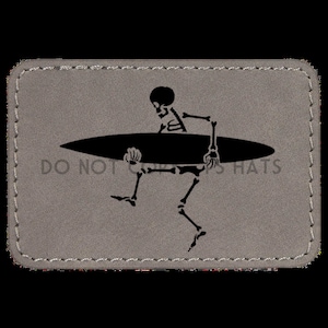 May include: A grey patch with a black skeleton surfing on a black surfboard. The text "DO NOT" is visible at the bottom of the patch.