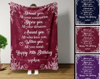 May include: A maroon fleece blanket with white floral designs and the text "Behind you, All your memories. Before you, All your dreams. Around you, All who love you. Within you, All you need. Happy 70th Birthday sophia"