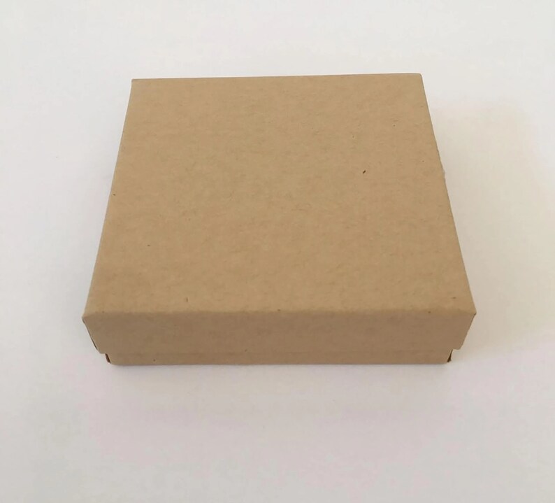 May include: A plain brown cardboard box with a square shape.