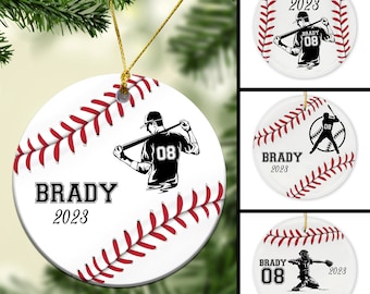 May include: White ceramic baseball ornament with red stitching. A black silhouette of a baseball player is on the ornament. The text "BRADY 2023" is printed on the ornament.
