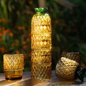 Pineapple glassware set. 4 glasses that, when stacked on top of each-other look like a pineapple fruit. They are orange, cut and perfect for a cocktail party