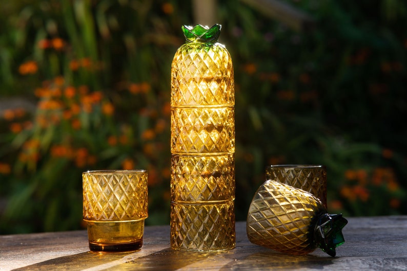 Pineapple glassware set. 4 glasses that, when stacked on top of each-other look like a pineapple fruit. They are orange, cut and perfect for a cocktail party