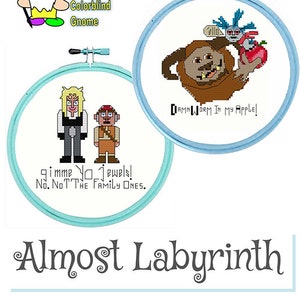 May include: Two cross-stitch hoops with Labyrinth-themed designs. One features characters with the text "gimme yo jewels! No. NOT THE FAMILY ONES." The other shows a worm and apple with the text "DAMN WORM IN MY APPLE!" The text "Almost Labyrinth" and "Worm & Jewels" are also present.