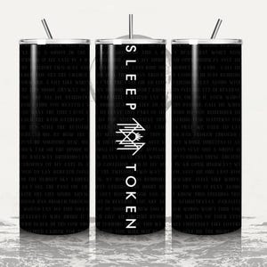 May include: A black cylindrical tumbler with a metal straw, featuring white text lyrics covering the surface and the vertical white text "SLEEP TOKEN" above a geometric white logo centered on the front. The design is consistent across the cup.