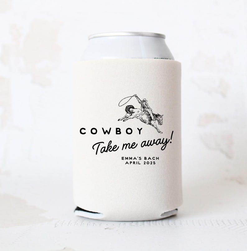 May include: White can cooler with a black and white illustration of a cowboy riding a horse. The text "COWBOY Take me away!" is printed on the cooler, along with the text "EMMA'S BACH APRIL 2025".