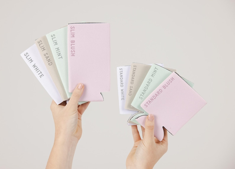 May include: Two hands displaying a selection of drink koozies in pastel shades. The koozies are labelled with colour names like 'Slim Blush' and 'Standard Mint'. The koozies are in shades of pink, mint green, and beige.