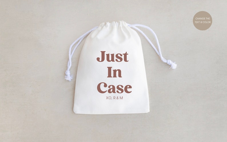 May include: White drawstring bag with the text "Just In Case" in brown lettering and the initials "XO, R&M" printed below.