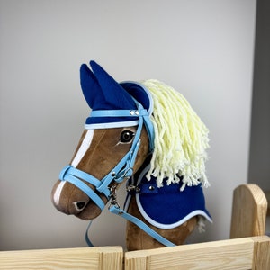 A3 / A4 Hobby Horse set. Dark blue with light edging. Ear bonnet and blanket with optional halter or bridle. No hobby horse is included.