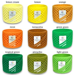 May include: Nine spools of colorful yarn, each wrapped in a criss-cross pattern. The yarn colors are lemon cream, lemon, orange, neon, terracotta, green grass, tropical green, pistachio, and light green. Each spool has a label that reads "МАРМЕЛАД".