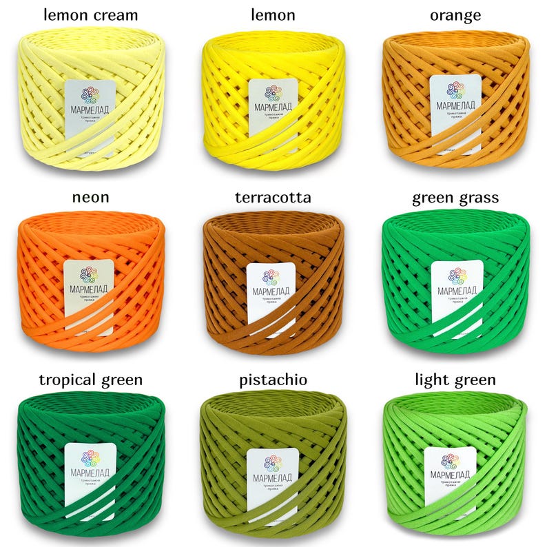 May include: Nine spools of colorful yarn, each wrapped in a criss-cross pattern. The yarn colors are lemon cream, lemon, orange, neon, terracotta, green grass, tropical green, pistachio, and light green. Each spool has a label that reads "МАРМЕЛАД".
