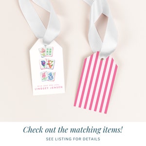 May include: Two gift tags, one with a pink and white striped design and the other with a white background and colorful illustrations of Chinese dominoes. The text on the tag reads "WITH LOVE AND LUCK, LINDSEY JENSEN".