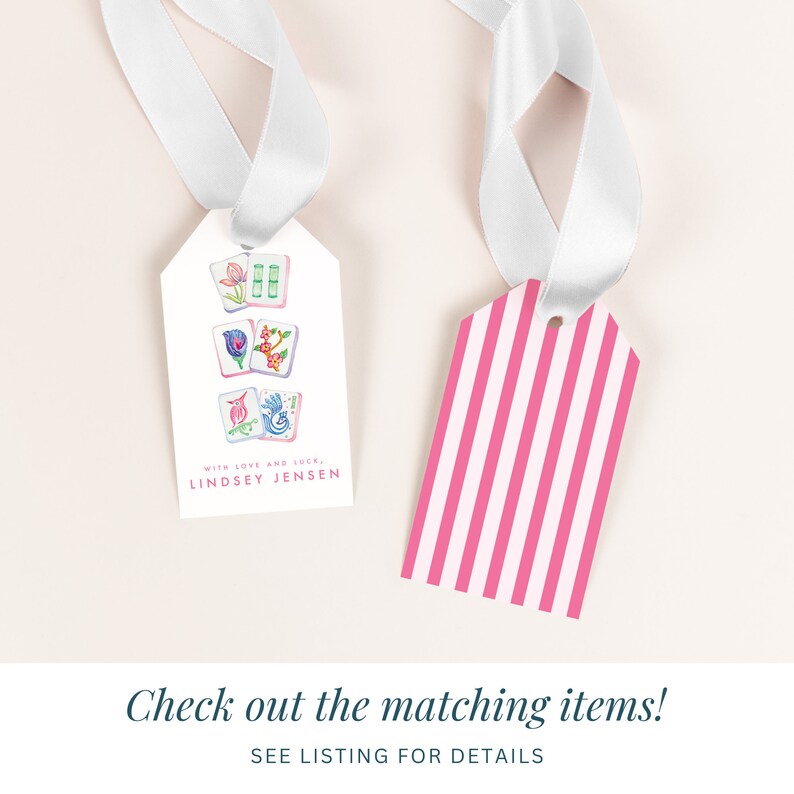 May include: Two gift tags, one with a pink and white striped design and the other with a white background and colorful illustrations of Chinese dominoes. The text on the tag reads "WITH LOVE AND LUCK, LINDSEY JENSEN".
