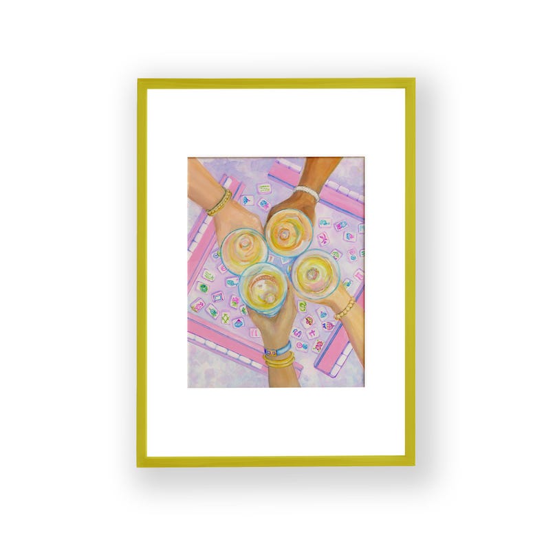 Puede incluir: Una pintura de acuarela enmarcada representa cuatro manos levantando copas de una bebida amarilla. Las manos est&aacute;n adornadas con pulseras. El fondo muestra un tablero de juego rosa y morado.