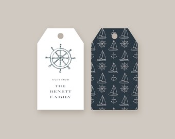 May include: Two gift tags with a nautical theme. The left tag is white with a black and white illustration of a ship's wheel and the text "A gift from The Bennett Family". The right tag is dark blue with a white pattern of sailboats, anchors, and ship's wheels.
