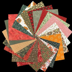 May include: A collection of fabric squares arranged in a circular pattern. The squares feature various patterns, including floral, paisley, and geometric designs. Colors include red, green, orange, and cream, creating a vibrant and textured display. The fabric appears to be cotton.