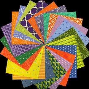 May include: A circular arrangement of colorful fabric squares with various patterns, including polka dots, paisley, and geometric designs. The squares are in shades of orange, purple, green, blue, and yellow, creating a vibrant and eye-catching display. Ideal for quilting or craft projects.