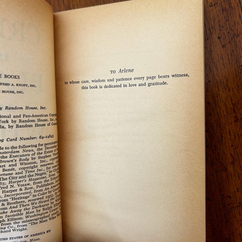May include: A cream-colored book page featuring a dedication printed in black ink that reads: TO Arlene to whose care, wisdom and patience every page bears witness, this book is dedicated in love and gratitude. The left margin shows copyright text.