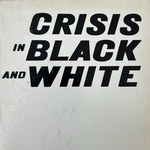 May include: A book cover with a white background and bold, black, sans-serif text that reads CRISIS IN BLACK AND WHITE. The title is arranged in three lines with the words CRISIS, BLACK, and WHITE in large font, and IN and AND in smaller font.