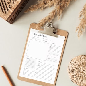 May include: A white ceramic notes planner on a brown clipboard. The planner has sections for date, ingredients, measurements, clay, temperature, and notes.