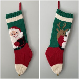 May include: Two knitted Christmas stockings, one with a Santa Claus design and the other with a reindeer design. Both stockings are red, green, and white.