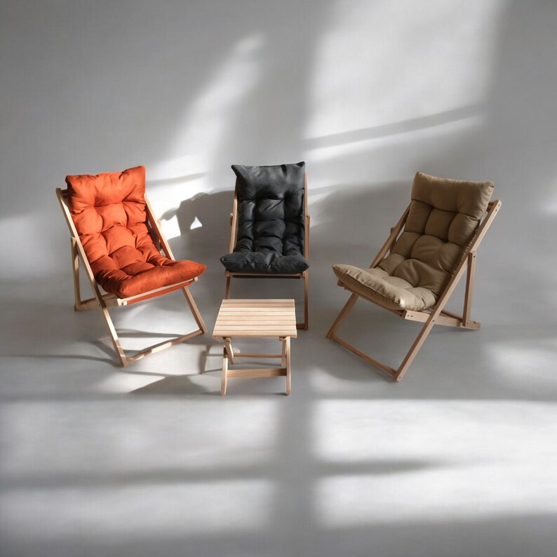 May include: Three wooden folding chairs with fabric cushions in orange, black, and beige, and a small wooden folding table.