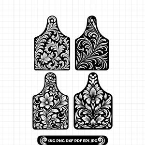 May include: Four black and white decorative cutting boards with floral and scrollwork designs. Each board has a handle and a unique pattern of leaves and flowers. The bottom of the image includes the text "SVG PNG DXF PDF EPS JPG".