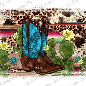 May include: A pair of brown cowboy boots with blue and white embroidery, set against a background of a leopard print and a colorful striped pattern. The boots are surrounded by cactus plants with yellow flowers.