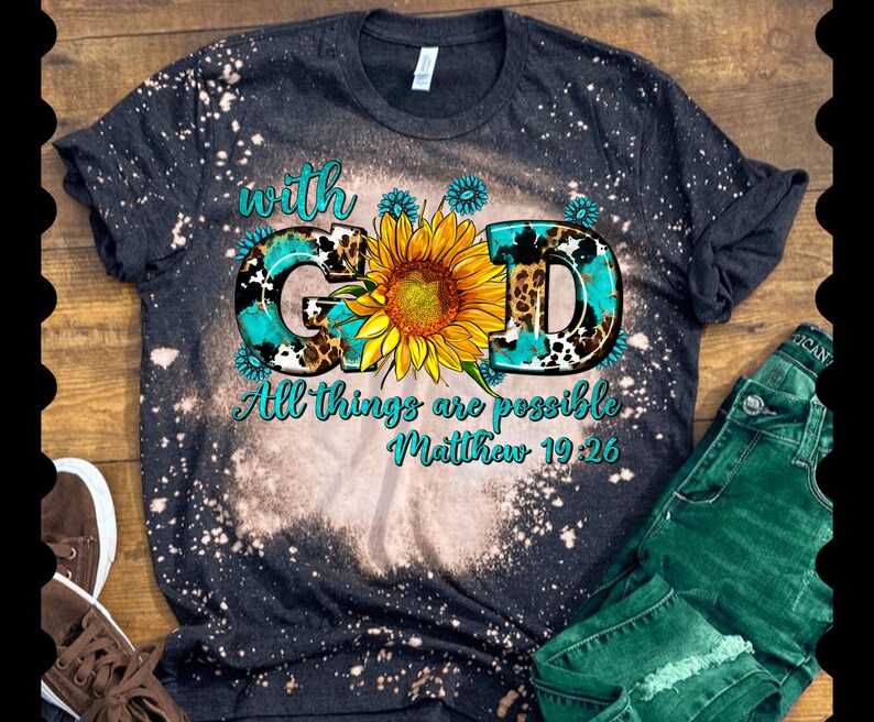 May include: Black bleached t-shirt with a turquoise, leopard print, and sunflower design. The text "with God All things are possible Matthew 19:26" is printed on the shirt.