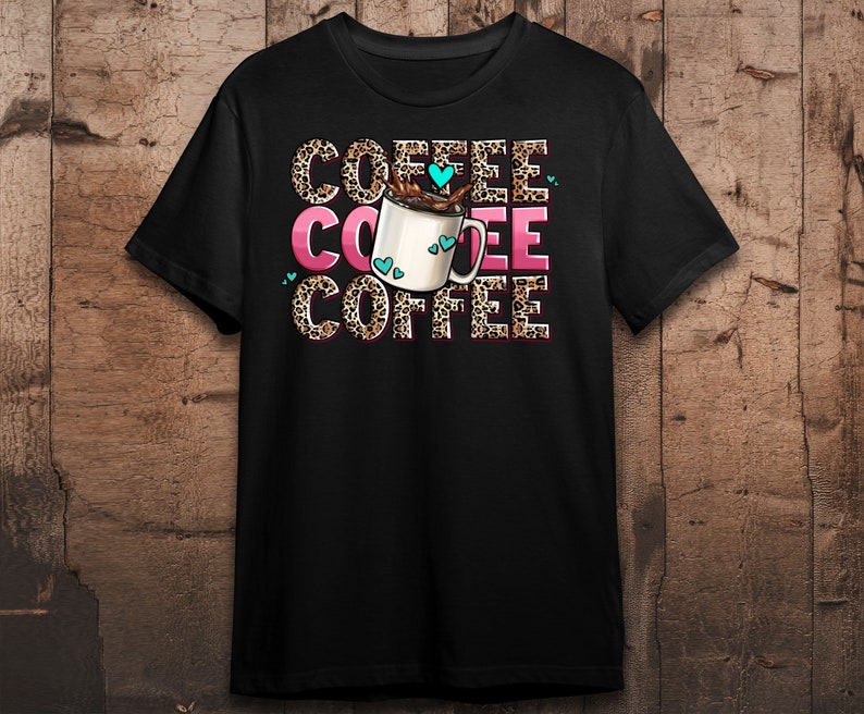 May include: Black t-shirt with a graphic of a coffee cup with hearts and the word "COFFEE" repeated three times in a leopard print pattern.