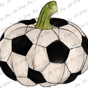 May include: A white and black soccer ball shaped like a pumpkin with a green stem.