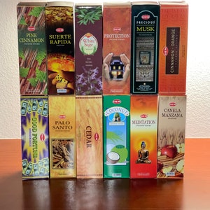 May include: Assortment of HEM incense sticks in various scents, including Pine Cinnamon, Suerte Rapida, White Sage, Protection, Precious Musk, Cinnamon Orange, Good Fortune, Palo Santo, Cedar, Coconut, Meditation, and Canela Manzana.