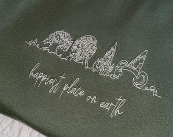 Sudadera de cuello redondo bordada con el diseño "El lugar más feliz" / Diseño minimalista con silueta de parque.