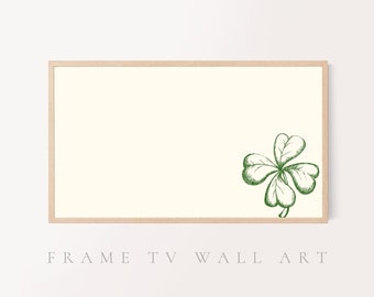 May include: A framed print of a green four-leaf clover on a white background.