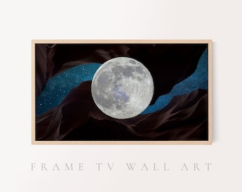 May include: A framed wall art print featuring a full moon centered in a dark canyon with a starry night sky. The artwork is in a rectangular wooden frame, creating a striking contrast between the natural elements.