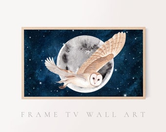 May include: Watercolor painting of a barn owl in flight, set against a dark blue starry night sky and a large gray moon. The owl's wings are spread wide, showcasing its brown and white feathers. The artwork is framed in a light wood frame. Text at the bottom reads "FRAME TV WALL ART".