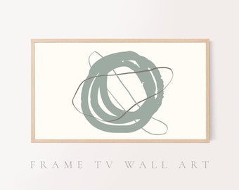 May include: Abstract wall art print featuring a light blue circle with overlapping lines and a dark gray line. The print is framed in a light wood frame.