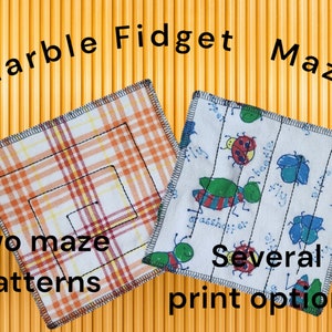 May include: Two fabric squares with different patterns. One square is a white and orange plaid with a black maze pattern. The other square is white with a green, red, and blue insect print. The text "Marble Fidget Maze" is at the top of the image. The text "Two maze patterns" is at the bottom left of the image. The text "Several print options" is at the bottom right of the image.