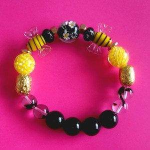 Bumble Bee Flower-armband met gele lampwork-kralen, heldere en zwart gestreepte lampwork-kralen, zwarte jaspis-kralen