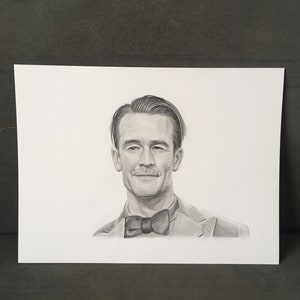 May include: A pencil drawing portrait of a man wearing a bow tie and a suit jacket. The portrait is in grayscale, with detailed shading to create depth and dimension. The man has short, neatly styled hair and a slight smile.