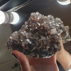 Calcite cluster with hematite and carbon inclusions