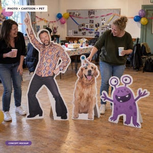 May include: Three life-sized cardboard cutouts featuring a man in a retro patterned shirt and bell-bottom trousers, a golden retriever wearing a party hat, and a purple cartoon monster with two eyes and spots, all standing on a wooden floor.
