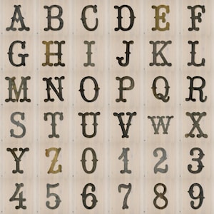 May include: A collection of dark, weathered metal letters from A to Z and numbers from 0 to 9, each featuring a distinct serif font style with a rustic, aged texture. The characters are arranged in a grid format, showcasing individual metallic pieces.