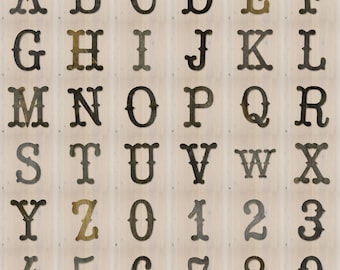 May include: A collection of dark, weathered metal letters from A to Z and numbers from 0 to 9, each featuring a distinct serif font style with a rustic, aged texture. The characters are arranged in a grid format, showcasing individual metallic pieces.